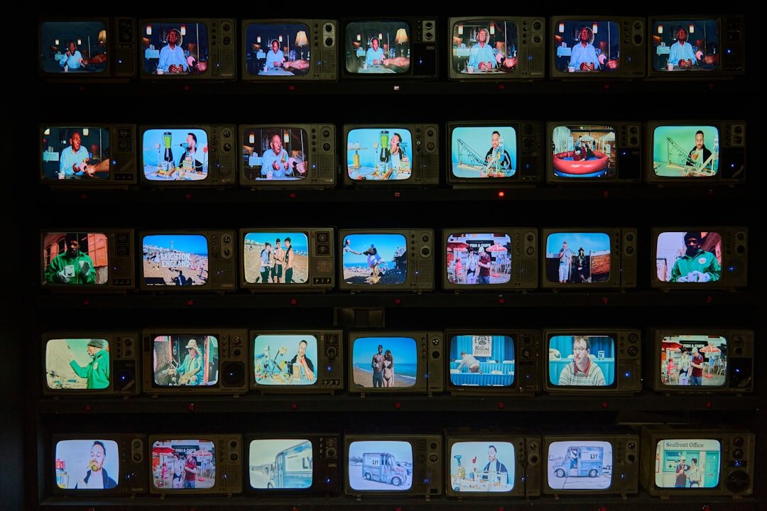 Video editors reviewing raw footage on multiple screens
